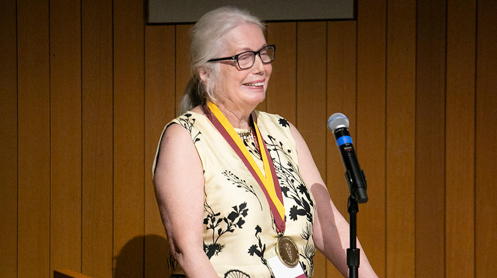 Eva Bading, MD, FAAFP accepts the 2025 Stritch Medal at the Stritch School of Medicine Alumni Awards.