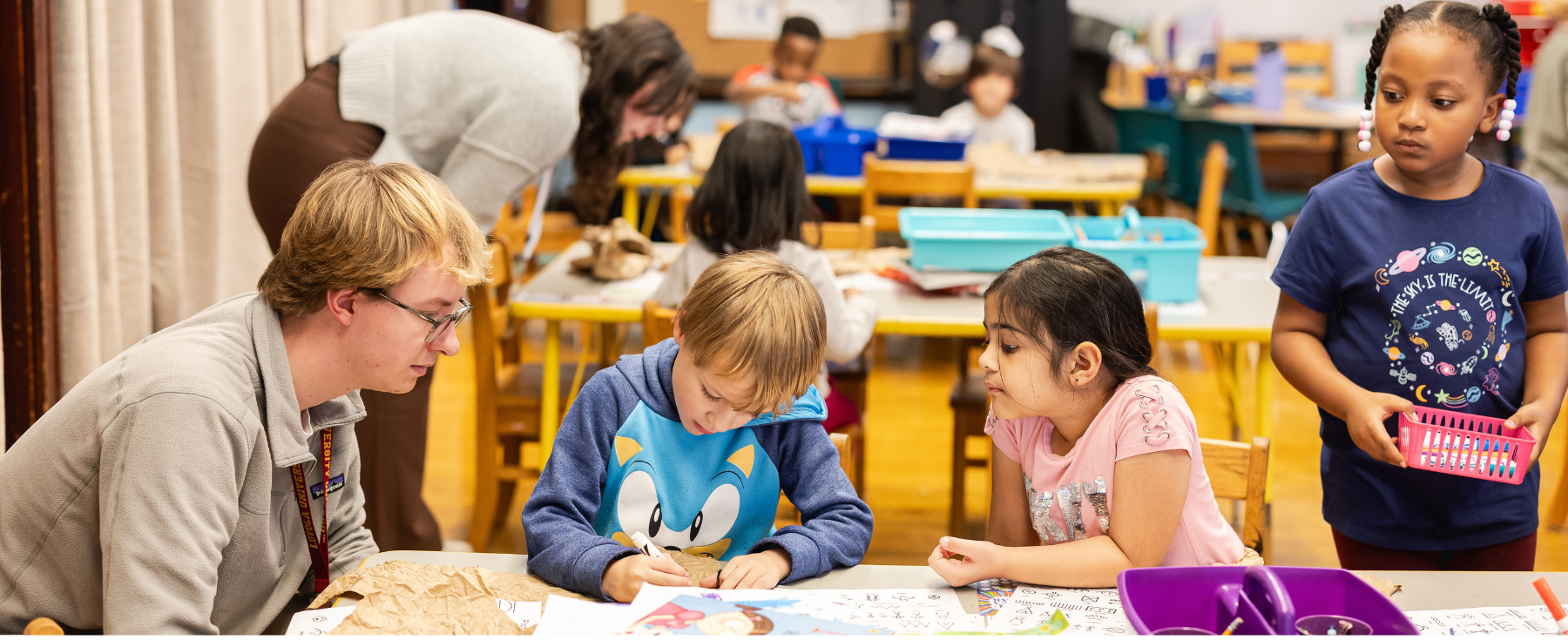 Loyola students within a elementary classroom