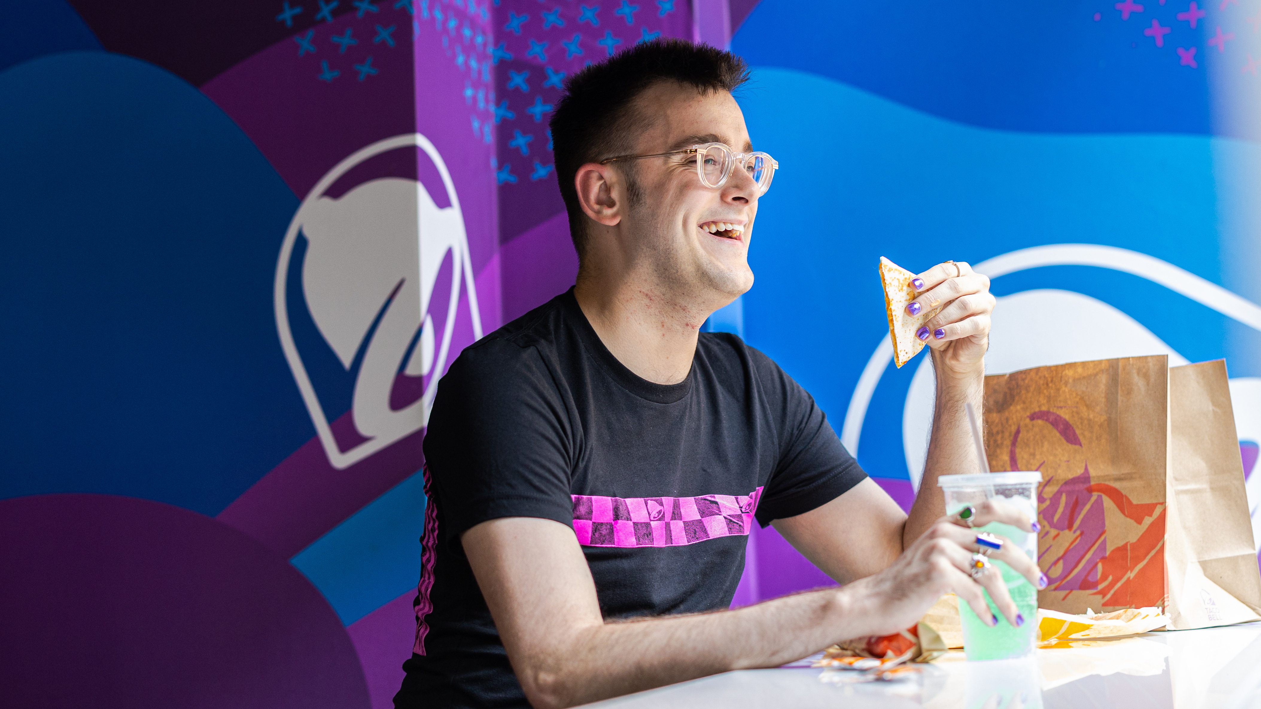 Loyola Alum Alex Minton eating at Taco Bell