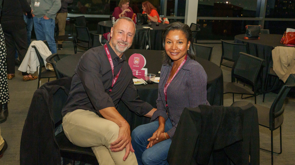 Alumni mingle at a JFRC event