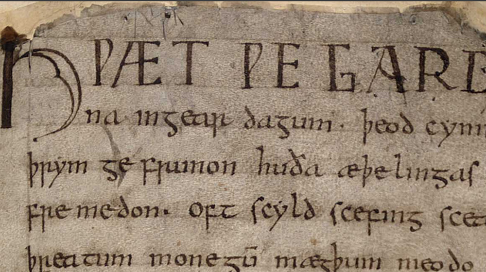 A picture of a medieval page with cursive script  written on it