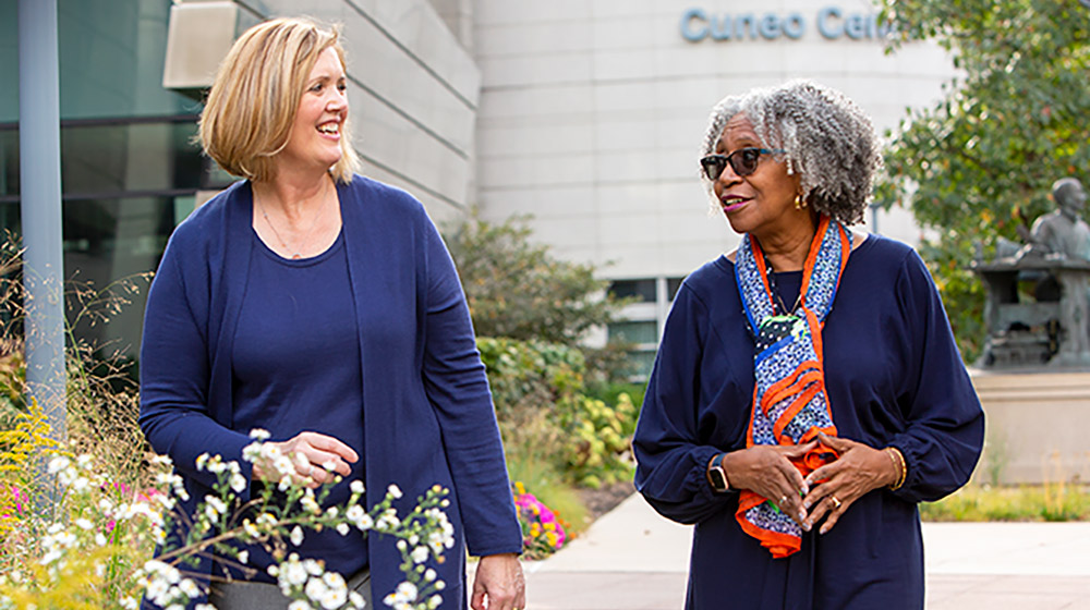 Karen Saban and Regina Conway-Phillips standing outside the Cuneo Center