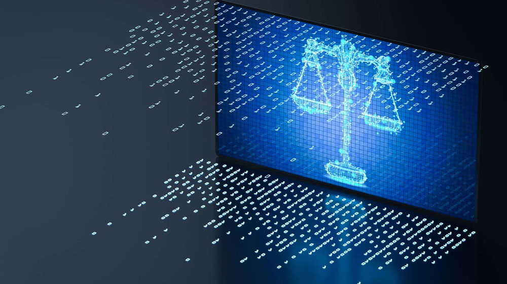 laptop with scales of justice on screen