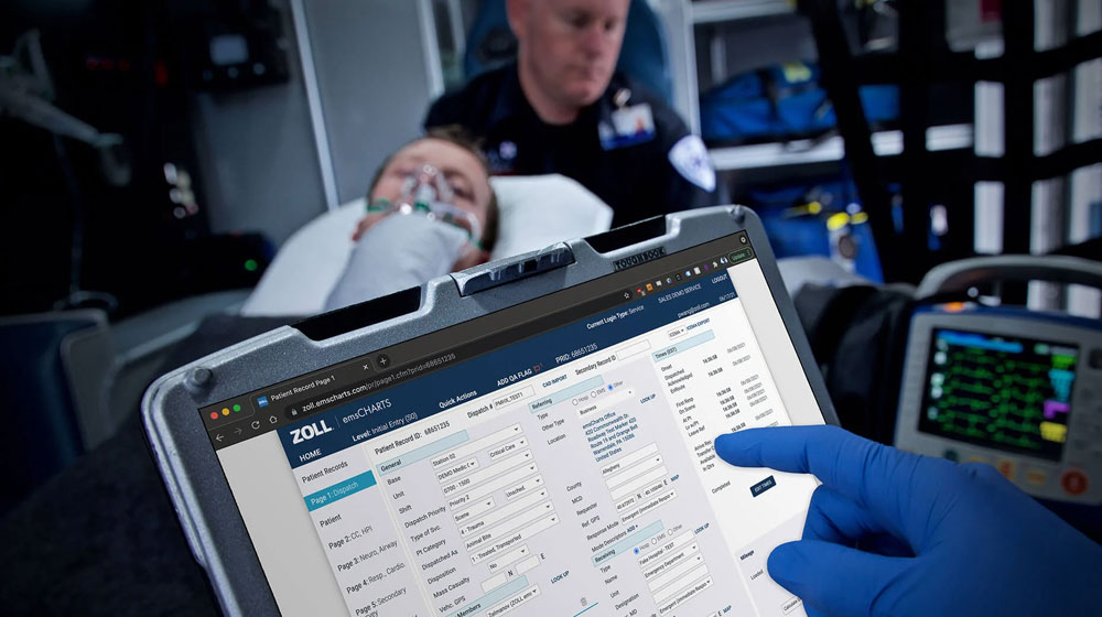 Paramedic using ipad screen while in ambulance