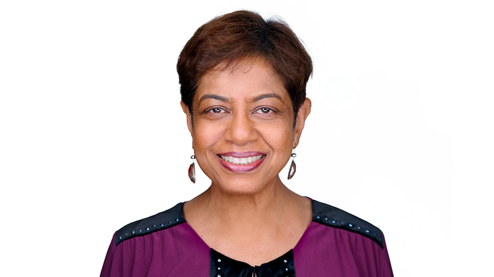 Jenny standing in front of a white background