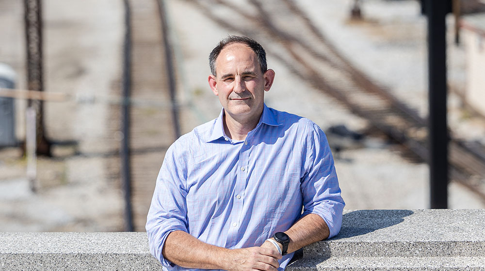 Mike Hewitt stands above a rail yard in Chicago