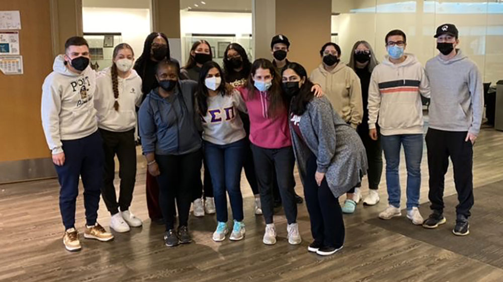Group of students standing in the Damen Student Center