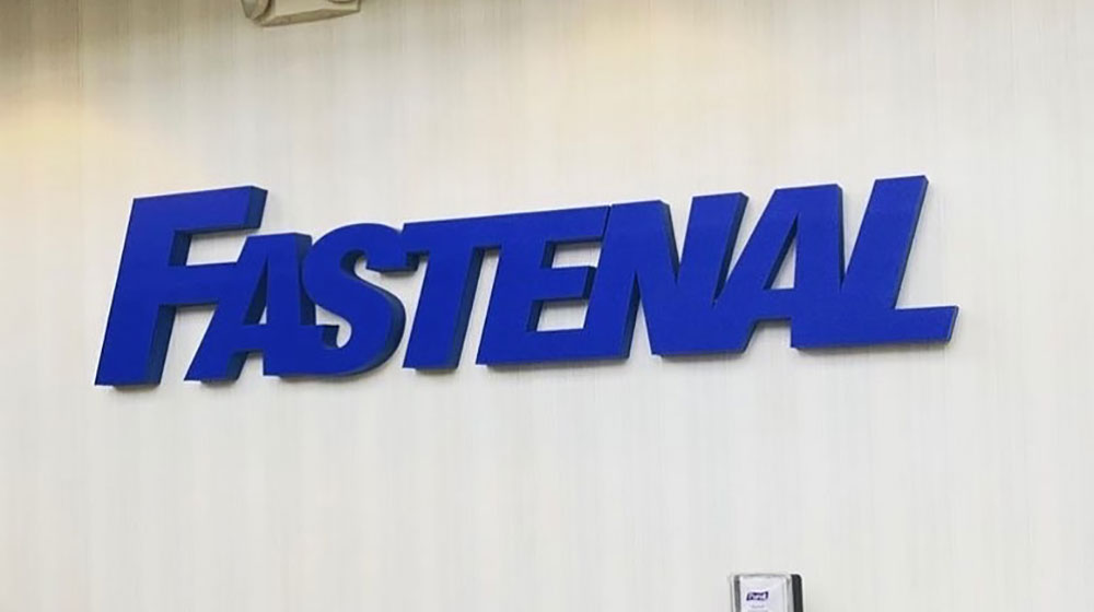 Photos of the Fastenal logo on an office wall