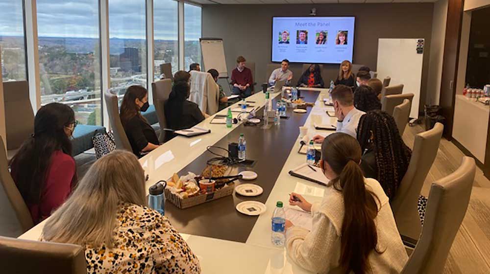 Students around a conference room table