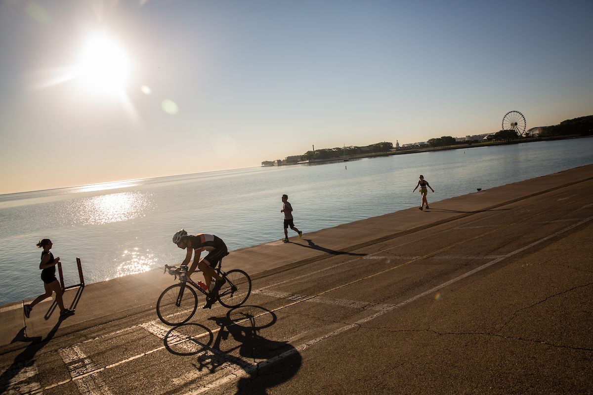 Loyola students running and biking along Lake Shore and Lake Michigan
