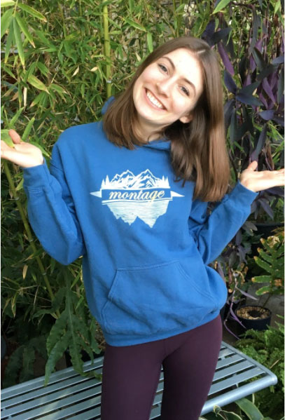 Image of Elise Anhorn smiling wearing a blue sweatshirt