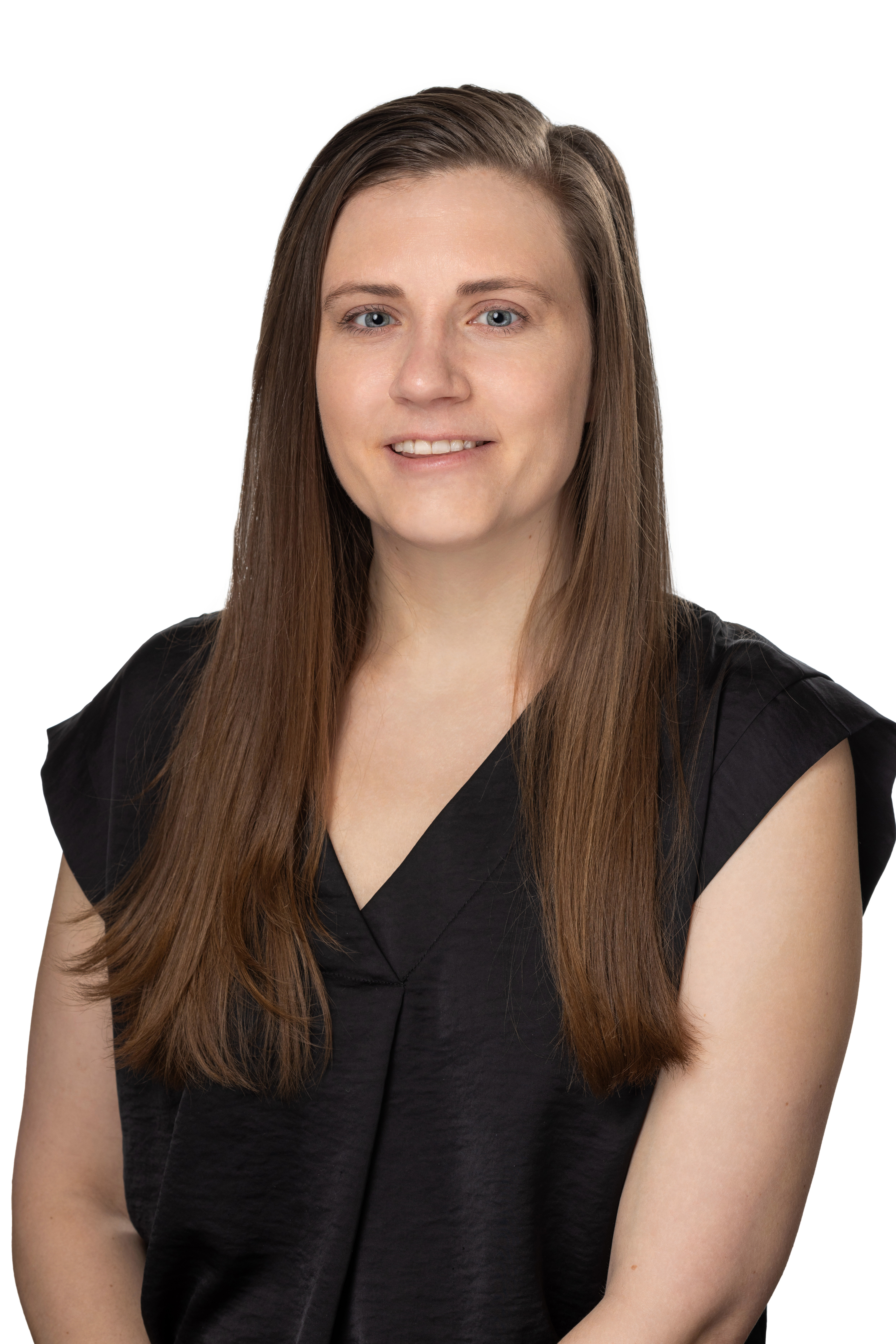 Headshot of a School of Social Work faculty member with long straight brown hair, wearing a black sleeveless blouse, looking at the camera against a light gray background.