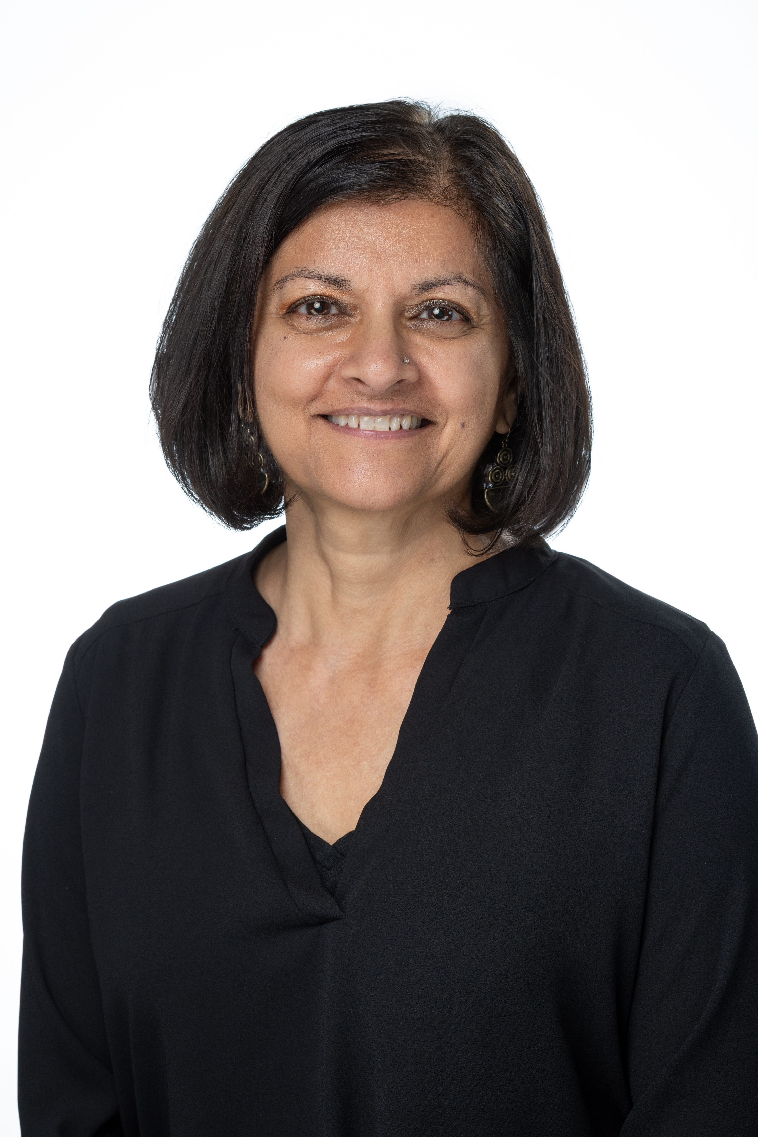 Portrait of Binita M. Donohue, MSW, LCSW, Clinical Assistant Professor, wearing a black blouse against a light background.