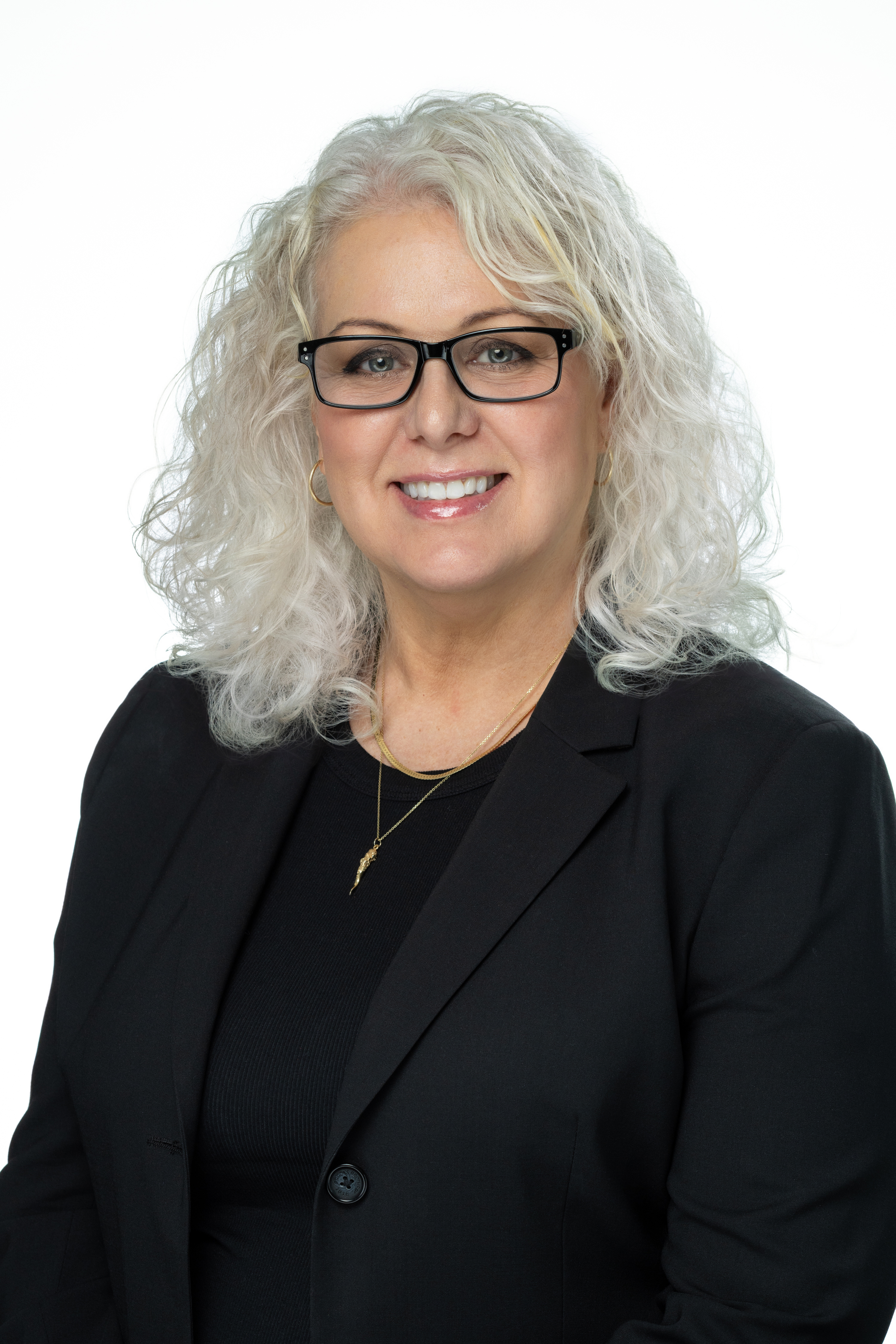 Shannon Dunn, Ph.D., LCSW, CRADC, Clinical Associate Professor, wearing a black blazer and glasses against a light background.