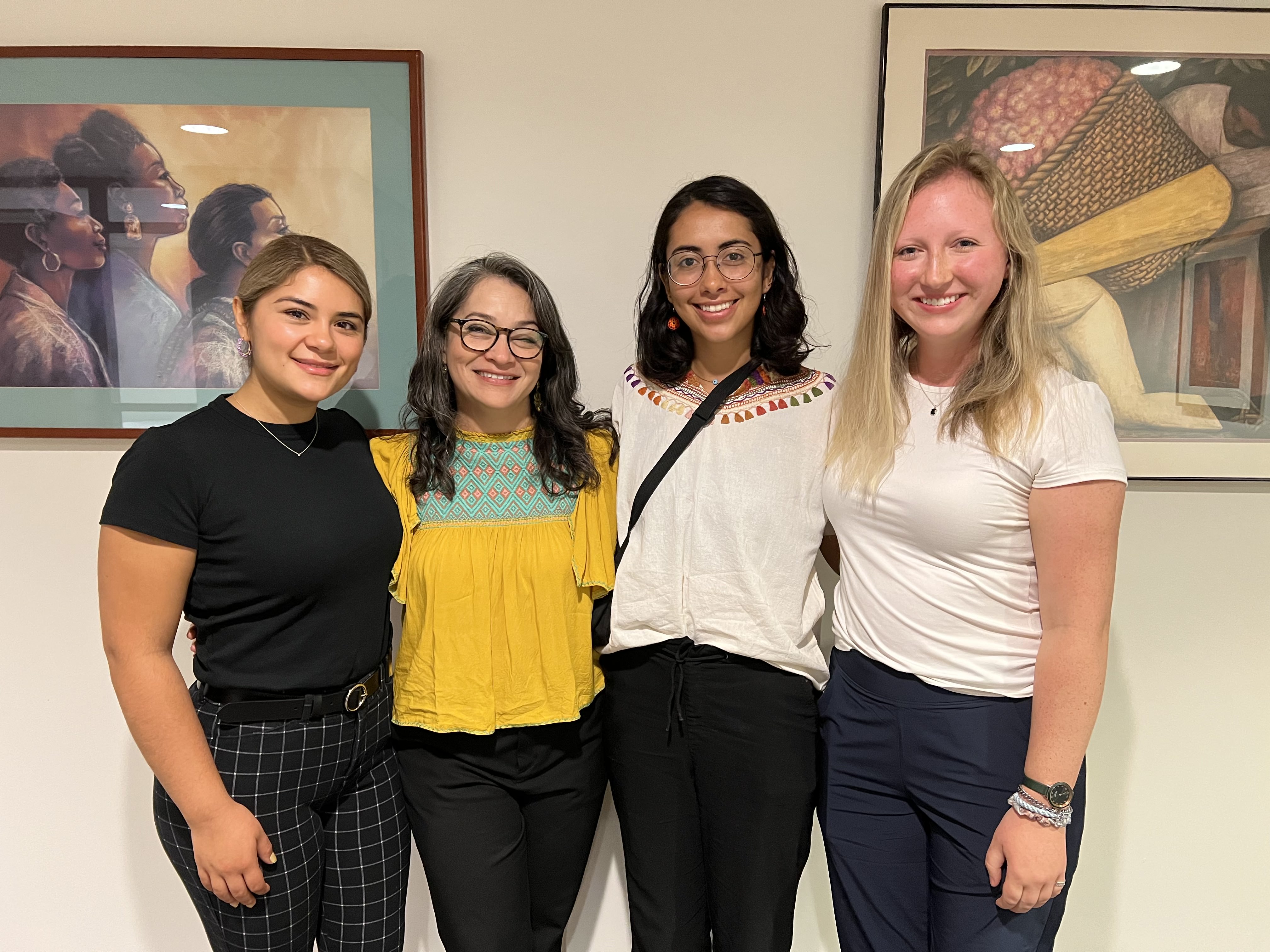 Three SSW student volunteer interpreters pictured with their supervisor