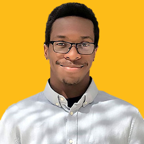 Portrait of Loyola University Chicago student smiling against yellow background