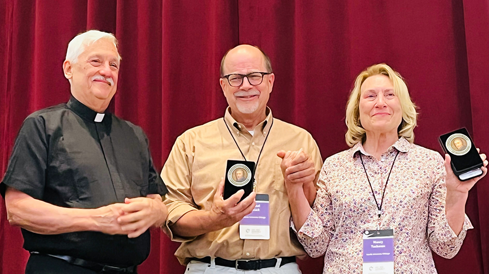 Nancy Tuchman and Michael Schuck receive the Canisius Medal