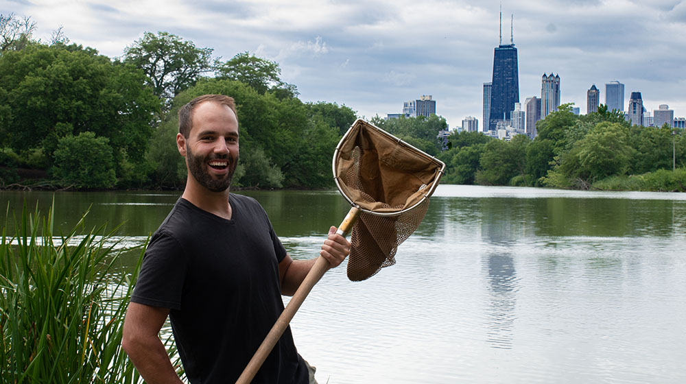 Carter Cranberg in front of a pond