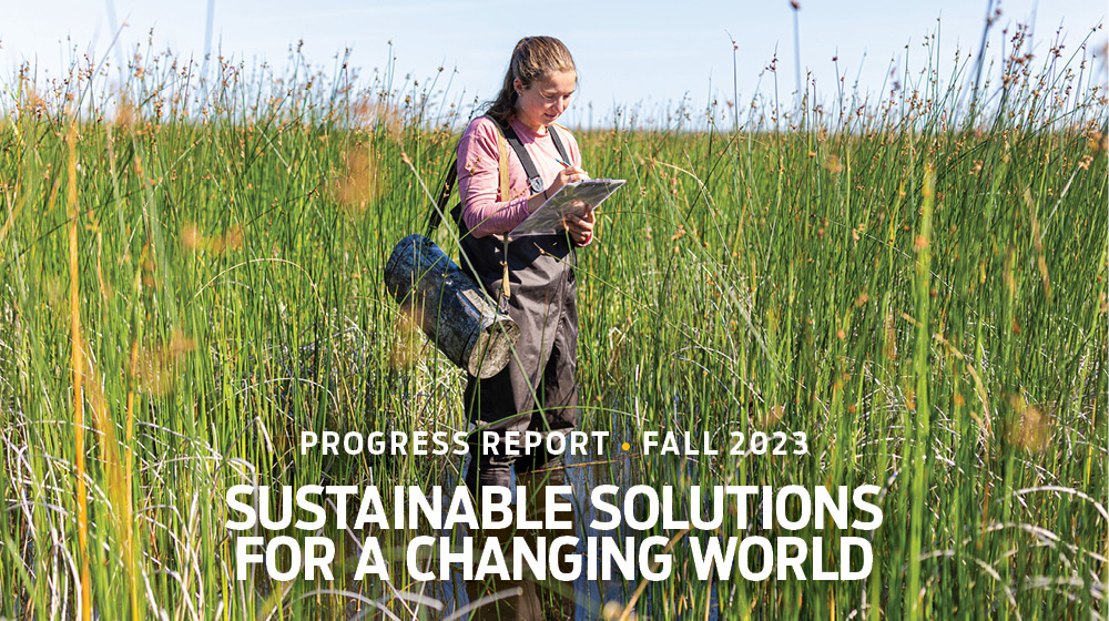 Report cover: student in waders in a wetland