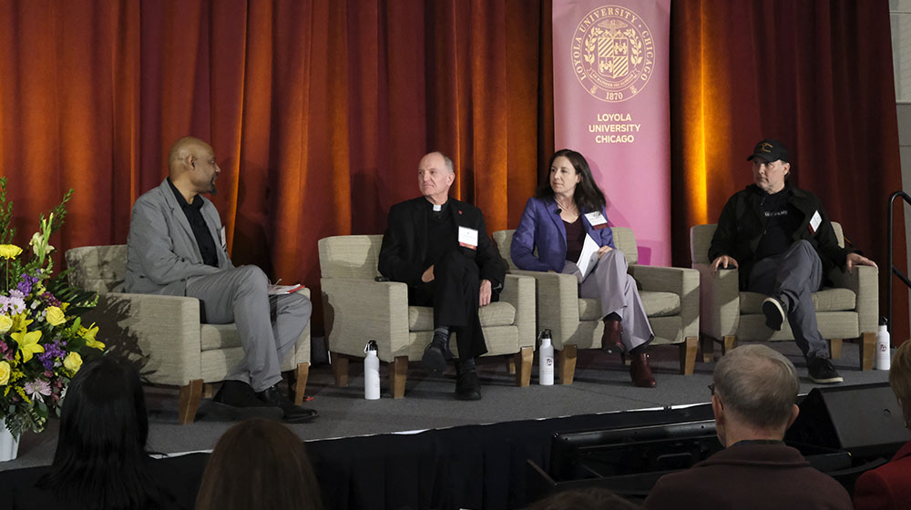 panelist on stage at the conference