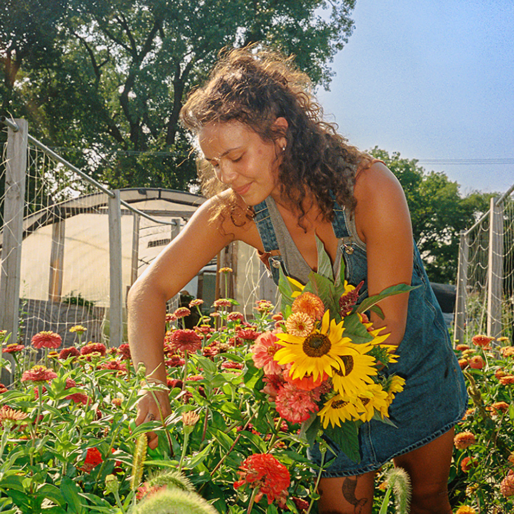 Alyssa Alcordo working in a garden