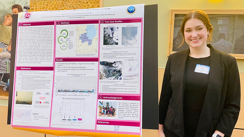 Nora Hartnett with a research poster