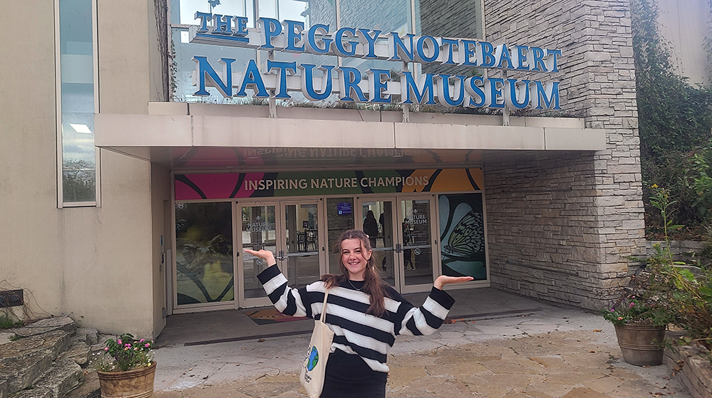 Kylah Farley in front of the Nature Museum