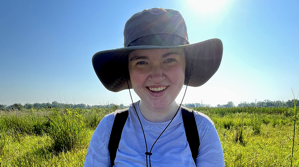 Nat Kath standing in a field
